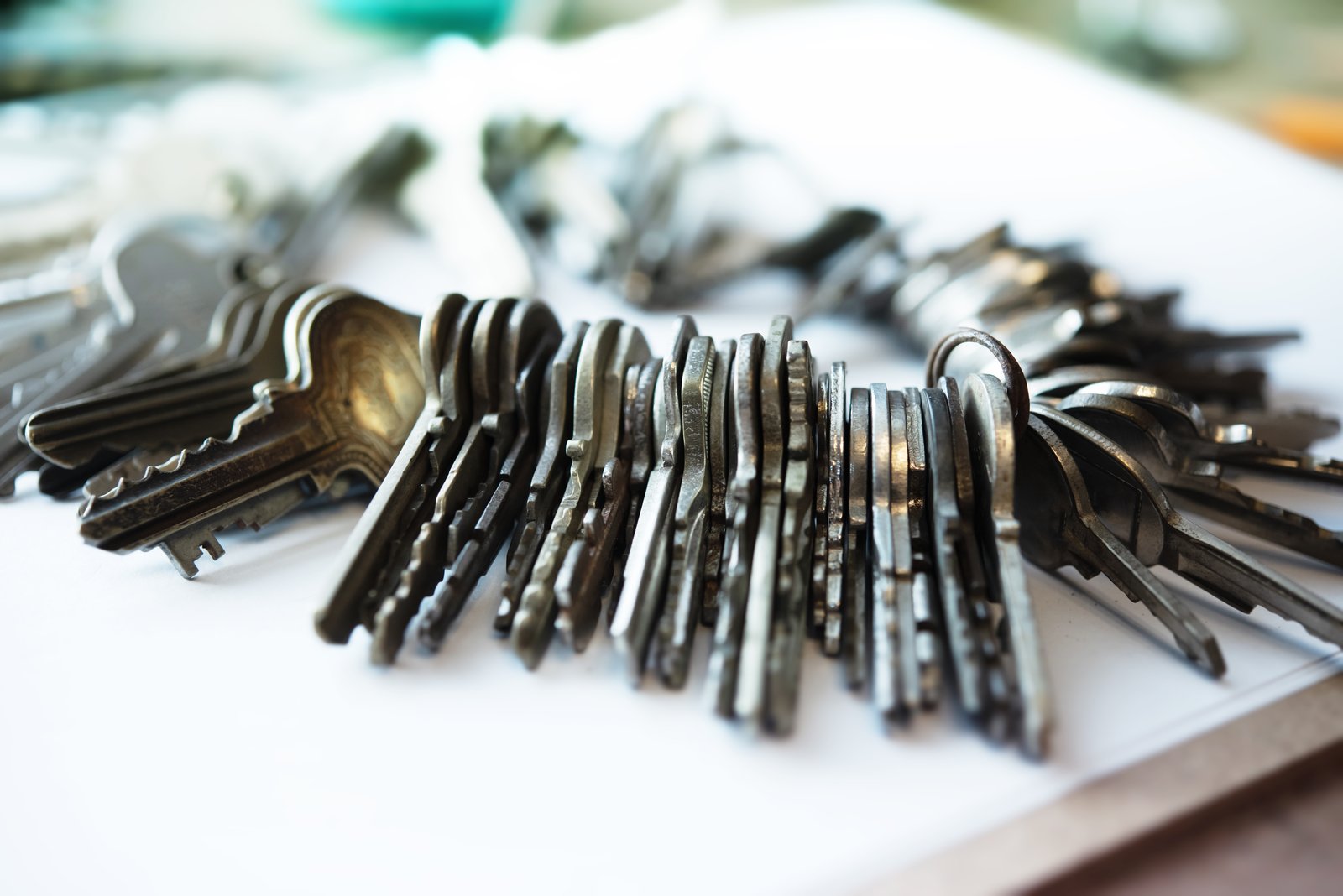 A bunch of old keys laid out on a table
